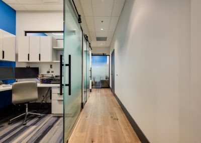 Workstation and hallway with glass office doors