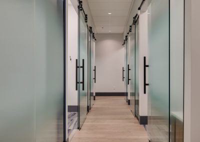 Hallway of glass office doors