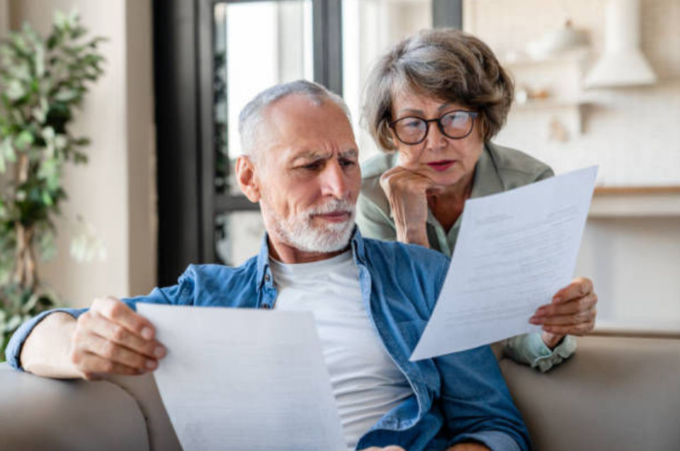 Older couple reviewing documents together